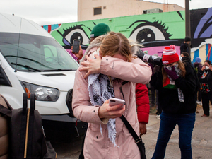 A demonstrator, visibly doused in pepper spray, reacts during a federal raid at Bro-Tex, a paper distributor St. Paul Tuesday, Nov. 18, 2025. Courageous citizenship may again be required this year to ensure a free and fair election. (Photo by Nicole Neri/Minnesota Reformer)