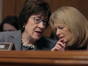 Senate Health, Education, Labor and Pensions Committee members Sen. Susan Collins (R-ME) (L) and Sen. Lisa Murkowski (R-AK) talk during the confirmation hearing for Lori Chavez-DeRemer, President Donald Trump’s pick to lead the Labor Department, in the Dirksen Senate Office Building on Capitol Hill on February 19, 2025 in Washington, DC. A former Republican member of Congress from Oregon, Chavez-DeRemer was questioned about her co-sponsorship for the pro-union Protecting the Right to Organize Act, which may