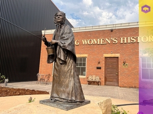The statue of Louisa Gardner Swain — the first woman to vote in Wyoming — stands outside the Wyoming Womens History House in Laramie. (Tennessee Watson/WyoFile)