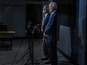 From the left, Rob Quinn and John Greer, both doctors, are part of a group of about 40 medical professionals who called for a pause to Tennessee’s executions on July 28, in Nashville, Tennessee. (Photo by John Partipilo/Tennessee Lookout)