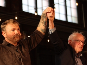 Independent U.S. Sen. Bernie Sanders of Vermont on Tuesday, July 7, 2026, said he told U.S. Senate candidate Graham Platner of Maine he should "step aside." In this photo, Sanders, right, rallies with Platner in Portland on May 25, 2026. (Photo by Emma Davis/ Maine Morning Star)