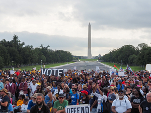 Demonstrators gathered at the Lincoln Memorial Reflecting Pool for an event in Washington, D.C., on Friday, Aug. 28, 2026, marking the 63rd anniversary of the March on Washington for Jobs and Freedom where the late civil rights leader Rev. Martin Luther King Jr. delivered his "I Have a Dream" speech. (Photo by Ashley Murray/States Newsroom)