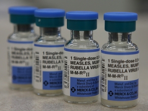 Vials of measles, mumps and rubella vaccine are displayed on a counter at a Walgreens Pharmacy on Jan. 26, 2015 in Mill Valley, California.  (Photo by Illustration Justin Sullivan/Getty Images)