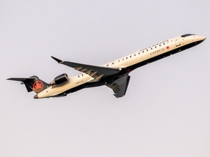 President Donald Trump has targeted Canadian airline manufacturer Bombardier in his trade war with Canada. In this photo, an Air Canada Express Bombardier CRJ900 aircraft departs Ronald Reagan Washington National Airport. (Photo by Getty Images/Yassine Bahammou)