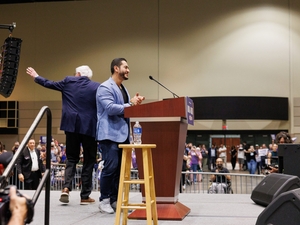 Michigan U.S. Senate candidate Abdul El-Sayed, right, speaks at a rally with U.S. Sen. Bernie Sanders, left, U.S. Rep. Alexandria Ocasio-Cortez and U.S. House candidate William Lawrence in Lansing, Michigan, on July 19, 2026. (Photo by Andrew Roth/Michigan Advance)