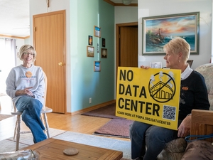 Vicki Wanamaker, left, and Cathy Mager, right, talked in Wanamaker's Springdale, Pennsylvania, home on Oct. 19, 2026, about their opposition to a proposed hyperscale data center roughly a quarter mile away. (Photo by Ashley Murray/States Newsroom)