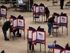 Voters mark their ballots during the first day of early voting at the Bismarck Event Center in Bismarck, North Dakota, on Oct. 22, 2026. (Photo by Jack Dura/North Dakota Monitor)