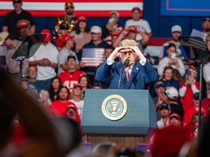 President Donald Trump speaks during an Oct. 19, 2026, rally at the Heartland Credit Union Arena in Park City, Kansas. (Photo by Sherman Smith/Kansas Reflector)