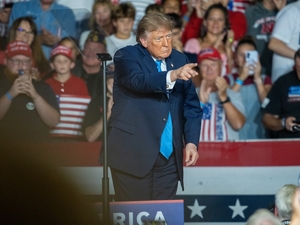 President Donald Trump points into the crowd after headlining a midterms rally in Grand Island, Nebraska, on Oct. 5, 2026, at the Nebraska State Fairgrounds, with thousands in attendance. (Photo by Zach Wendling/Nebraska Examiner)