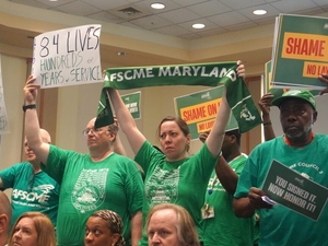 Union urges university board to reconsider decision to lay off employees