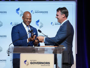 Moore touts friendship with GOP governor as he takes over national association