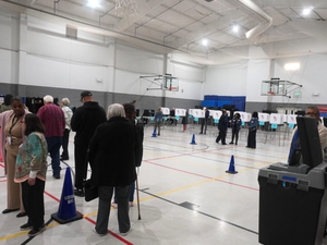 On a quiet first day of early voting, officials make a lot of noise about Question 3