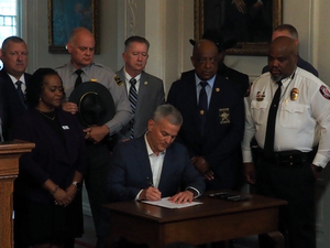 Stein signs public safety bills for police retention, online safety for minors in NC