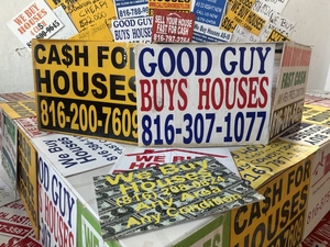 The signs offer quick cash for homes. But states want more oversight.