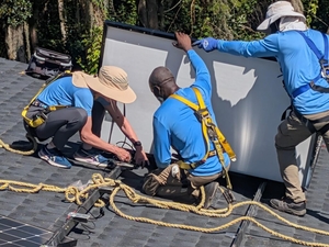 Gwen Graham spends a ‘workday’ helping to install solar panels