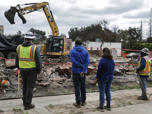 Their town burned to the ground. Should they get a pass from California’s new housing laws?