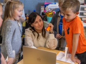 Lower elementary educator Bree Uresk works with students at Powder River Prep in Casper. (Dan Cepeda for WyoFile)