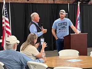 Midwest Republican Rep. Bill Allemand, left, introduces Bar Nunn Mayor Peter Boyer at a July 2025 town hall meeting regarding Radiant Industries' plans — since scrapped — to manufacture nuclear microreactors. (Dustin Bleizeffer/WyoFile)