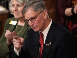 Gov. Mark Gordon points toward his audience while giving the State of the State address Monday, Feb. 9, 2026 at the Capitol. (Mike Vanata/WyoFile)