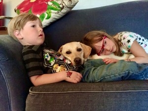 The Wolfson kids cuddle their dog, Nico, in May 2016. (Contributed)