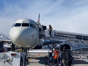 Passengers board a jet at the Jackson Hole Airport in Grand Teton National Park. (Angus M. Thuermer Jr./WyoFile)