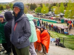 Michelle Ohmart smiles as she approaches the counter at Snow King Mountain in Jackson Hole on May 21, 2026, to buy tickets to Widespread Panic's July 5 concert atop the Town Hill. Ohmart said she got in line at 4:20 Thursday morning. Others spent the night in line. (Angus M. Thuermer Jr./WyoFile)