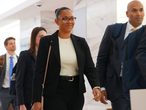 California couple confront their surrogate in a Texas court as dispute over newborn escalates