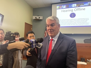 Fired Indiana utility regulator sues governor over his removal