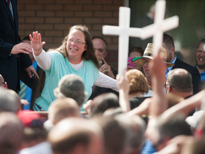 Couple denied wedding license by Kim Davis allege she has covered up assets owed them