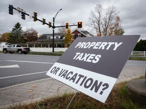Gov. Scott put property taxes and school consolidation center stage. Now Amanda Janoo is rallying opposition.