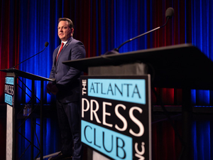 Burt Jones takes shots at absent rival on the debate stage as Rick Jackson hits the campaign trail