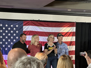Iowa, national politicians court voters at CyHawk tailgates