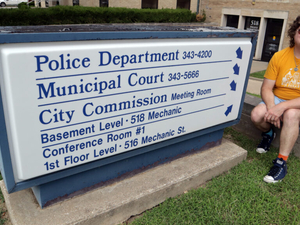 Clap during a city meeting in Emporia and you too might be hustled off to jail. Just ask Lux.