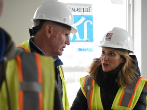Benson pushes for state, federal housing support on tour of Lansing affordable housing construction
