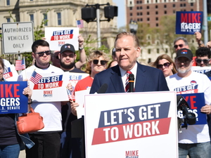 Mike Rogers claims he was an assembly line worker. The UAW said that is stretching the truth.