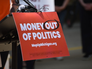 A ballot fight over corporate money in Michigan politics is coming to voters