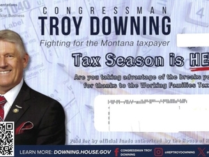 Who does Troy Downing work for?