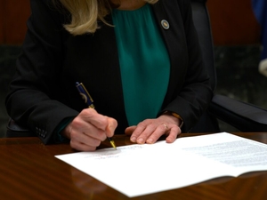 Virginia governor signs Dominion-backed bills. All eyes on regulators now.