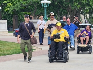 A wheelchair ride across Wisconsin calls attention to Medicaid cuts