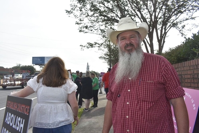 Wendell Shrock, left, runs security for Operation Save America’s protest in front of A Preferred Woman’s Health Center of Atlanta on July 21, 2023. (Ross Williams/Georgia Recorder)