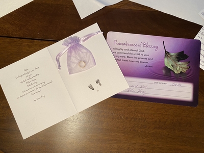 A card with the footprints of the fetus Jennifer Vollstedt lost in 2015 after it was diagnosed with triploidy, a fatal chromosomal condition. Vollstedt chose to terminate the pregnancy. (Courtesy of Jenn Vollstedt)