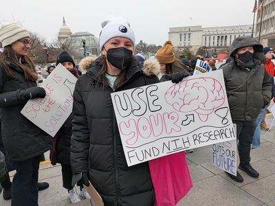 Sydney Woods, 27, a fourth-year PhD student studying neuroscience at George Washington University, attended a rally to support of federal workers outside the U.S. Department of Health and Human Services in Washington, D.C., on Feb. 19, 2025. (Photo by Ashley Murray/States Newsroom)
