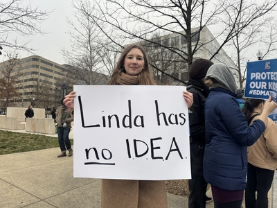 Molly Cronin, a special education teacher in Virginia, holds a sign that reads: "Linda has no I.D.E.A." — referencing the Individuals with Disabilities Education Act, or IDEA. During a recent interview on Fox News, U.S. Education Secretary Linda McMahon could not answer what the acronym stood for when asked. (Photo by Shauneen Miranda/States Newsroom)