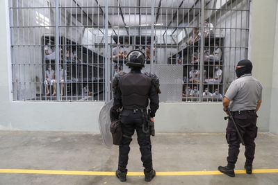 Prison officers stand guard a cell block at maximum security penitentiary CECOT (Center for the Compulsory Housing of Terrorism) on April 4, 2025 in Tecoluca, San Vicente, El Salvador. Amid internal legal dispute, Trump's administration continues with its controversial and fast-paced deportation policy to El Salvador, as part of a partnership with President Bukele. The US Government acknowledged mistakenly deporting a Maryland resident from El Salvador with protected status and is arguing against returning