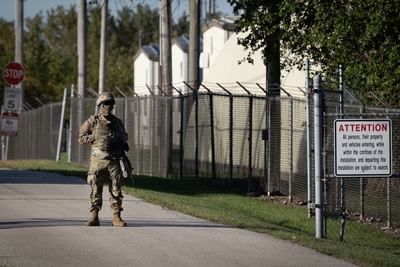 Members of the Texas National Guard stand guard at an army reserve training facility on October 07, 2025 in Elwood, Illinois. The Trump administration has been threatening for more than a month to send the guard to Illinois to address Chicago's crime problem and to support ICE and CBP during Operation Midway Blitz. Illinois Governor JB Pritzker has been outspoken in his opposition to the move, accusing the president of using the guardsmen as political pawns. (Photo by Scott Olson/Getty Images)
