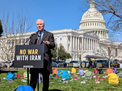 U.S. Sen. Chris Van Hollen, D-Md., on March 18, 2026, protested a U.S. strike on an elementary school in Iran against a backdrop of children's backpacks and shoes on Capitol Hill. (Photo by Ashley Murray/States Newsroom)