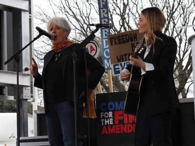 Folk musician and activist Joan Baez and singer-songwriter Maggie Rogers perform a rendition of Bob Dylan's "The Times They Are A-Changin'" at the Artists United for Our Freedoms rally outside the John F. Kennedy Center in Washington, D.C., on Friday, March 27, 2026. (Photo by Ashley Murray/States Newsroom)
