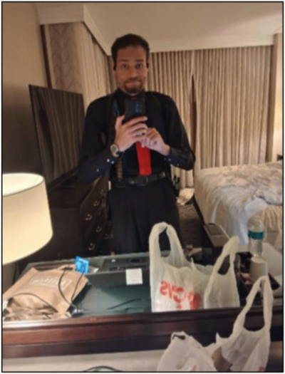 Cole Tomas Allen, the suspect in the shooting at the White House Correspondents' Association dinner, took this selfie in a Washington Hilton hotel room mirror prior to the attack, prosecutors allege. (Photo from court filing)