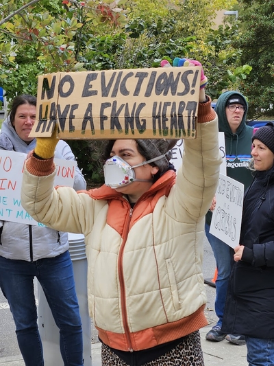 a demonstrator holds a sign