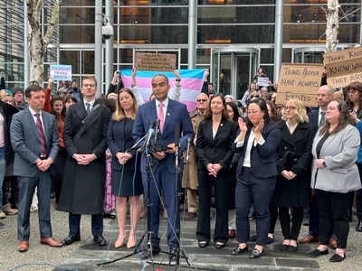 Washington Attorney General Nick Brown speaks outside the federal courthouse in Seattle